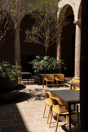 #cube-140:charcoal #net-chair:mustard