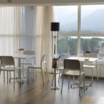 Riva Bistro Chair - Charcoal 4 Riva Chairs in White – Pictured in Indoor Restaurant Setting