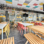 Bit Chair 7 Bit Chairs in Mustard and Coral Red in food court