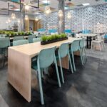 Bit Chair 6 Bit Chairs in Spearmint at wooden tables indoor cafeteria environment