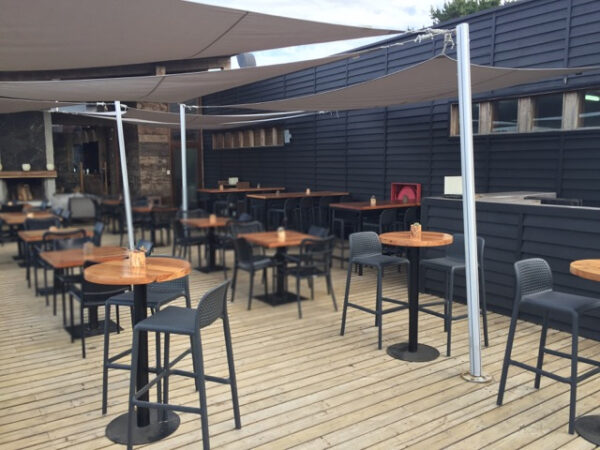 Lido Tall Outdoor Bar Stool - Charcoal (Pictured in Outdoor Bar Area on Wooden Deck)