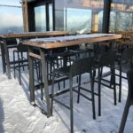 NARDI Lido Tall Outdoor Bar Stools in Charcoal at ski resort café in snow