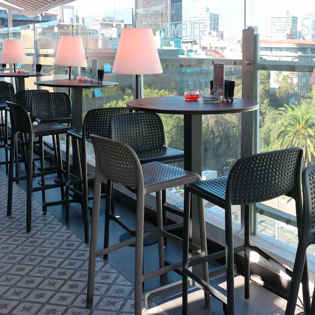 Nardi lido tall outdoor bar stools in charcoal and taupe at inner city covered outdoor balcony restaurant