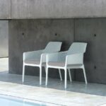 Two NARDI Net Relax Lounge Chairs in White and Grey Cushions poolside