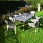 The Net Levante 7 Piece Dining Set in Taupe Pictured in a Garden Setting