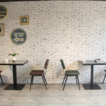 Aviator Mid-Century Modern Dining Chair 7 Aviator Mid-Century Modern Dining Chairs Along Cafe Wall
